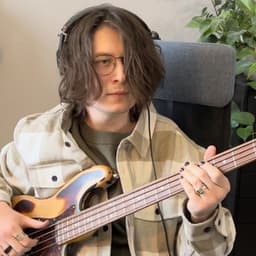 Anton playing a bass guitar